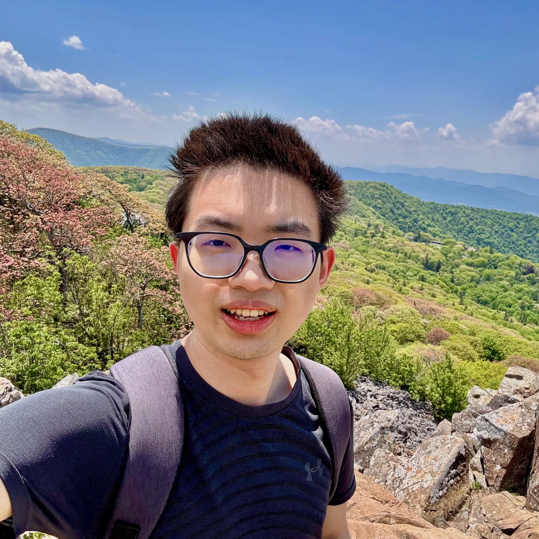Chenrui Fan outdoors on a mountain trail